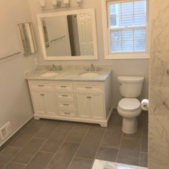 Mark Meredith - a bathroom with a shower, toilet, and sink - Painters Near Me Mark Meredith - a bathroom with a shower, toilet, and sink - Painters Near Me