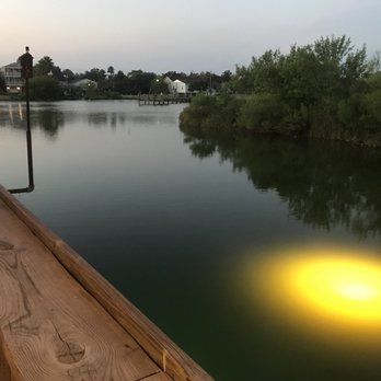 Aspens - a bench on a dock overlooking a lake - Bars Near Me - Clear Lake Shores, Texas