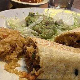 Burrito Al Pastor with rice and guacamole lettuce salad Burrito Al Pastor with rice and guacamole lettuce salad