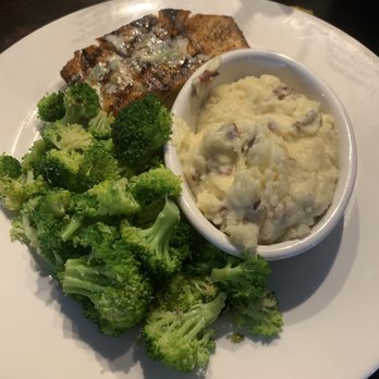 Local Goat - Salmon with mashed potatoes and steamed broccoli - New American Near Me - Pigeon Forge, Tennessee