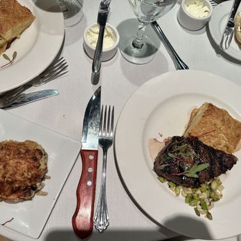 Shadowbrook - New York steak and potato au gratin with a side of mushroom bread pudding - American Near Me - Capitola, California Shadowbrook - New York steak and potato au gratin with a side of mushroom bread pudding - American Near Me - Capitola, California