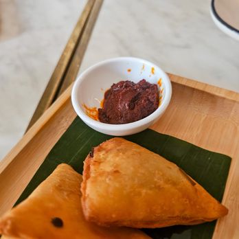 Makina Cafe - Sambusa- Crispy pastry filled with herbs, jalapenos, and choice of filling. Lentils for $9. Good. The side of awaze/chili - Ethiopian Near Me - Sunnyside, New York Makina Cafe - Sambusa- Crispy pastry filled with herbs, jalapenos, and choice of filling. Lentils for $9. Good. The side of awaze/chili - Ethiopian Near Me - Sunnyside, New York
