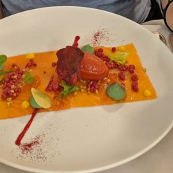 Les Pyrénées - A thin slab of salmon topped with a variety of unlikely items;  red popcorn at left,  beet sorbet toward the right