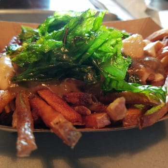 The Vanguard - Roasted garlic poutine and fries with mushroom gravy, fried basil, mornay, and whole roasted garlic cloves - Bars Near Me - Milwaukee, Wisconsin The Vanguard - Roasted garlic poutine and fries with mushroom gravy, fried basil, mornay, and whole roasted garlic cloves - Bars Near Me - Milwaukee, Wisconsin
