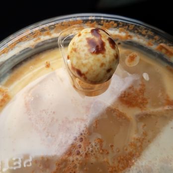 The Human Bean - Latte with cinnamon powder and the chocolate covered coffee bean - Coffee & Tea Near Me - Kingman, Arizona The Human Bean - Latte with cinnamon powder and the chocolate covered coffee bean - Coffee & Tea Near Me - Kingman, Arizona