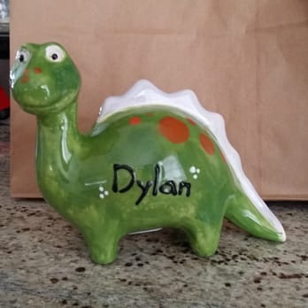 Color Me Mine - Dinosaur piggy bank after. - Paint-Your-Own Pottery Near Me - Brea, California