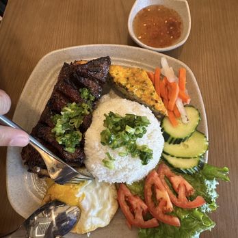 Saigon Bites - Grilled beef short rib with rice, egg, and fresh veggies - Vietnamese Near Me - Roseville, California Saigon Bites - Grilled beef short rib with rice, egg, and fresh veggies - Vietnamese Near Me - Roseville, California