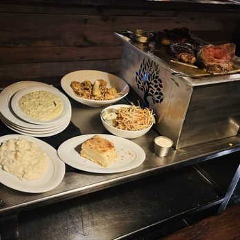 Twisted Tree - Dinner is served!  Steaks and sides come out on a hot tray for your server. - Seafood Near Me - Saint Louis, Missouri
