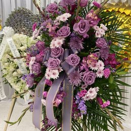 Big stand up purple theme floral spray