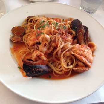 Piatti - Linguini with mussels, clams, salmon (fish of the day), calamari, garlic, parsley, crushed tomato sugo - Italian Near Me - La Jolla, California Piatti - Linguini with mussels, clams, salmon (fish of the day), calamari, garlic, parsley, crushed tomato sugo - Italian Near Me - La Jolla, California