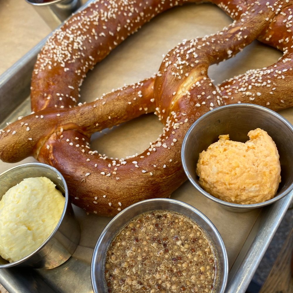 Easy Tiger - Pretzel with beer cheese, butter and mustard - Beer Gardens Near Me - Austin, Texas Easy Tiger - Pretzel with beer cheese, butter and mustard - Beer Gardens Near Me - Austin, Texas