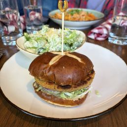 Hikers Harvest Burger - chickpea and quinoa patty with cucumber salad and tzatziki sauce. Side Caesar salad - 4/5