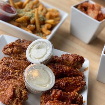 Bonchon Midtown Houston - a plate of fried chicken and french fries - Korean Near Me - Houston, Texas Bonchon Midtown Houston - a plate of fried chicken and french fries - Korean Near Me - Houston, Texas