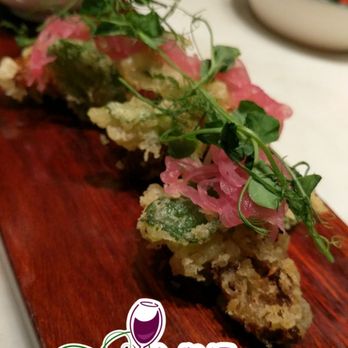 Uchi Houston - Fried something with microgreens and pickled shallots on the house - Sushi Bars Near Me - Houston, Texas