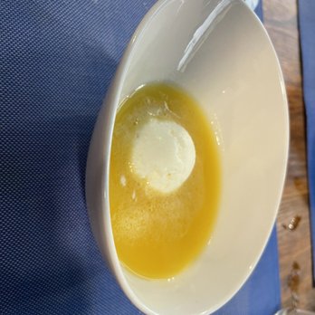 Petra - Coconut pineapple ice cream with pineapple soup.  Alex could not stomach the soup, and he has a sweet tooth. - Mediterranean Near Me - Barcelona, B