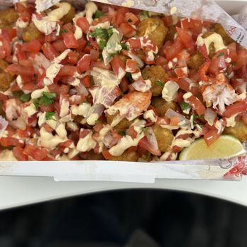 Cousins Maine Lobster - Detroit - Lobster tots...so much lobster, free tomatoes, and a lime. - Seafood Near Me Cousins Maine Lobster - Detroit - Lobster tots...so much lobster, free tomatoes, and a lime. - Seafood Near Me