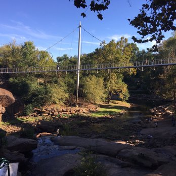 Falls Park - View of liberty bridge from the ground - Venues & Event Spaces Near Me - Greenville, South Carolina Falls Park - View of liberty bridge from the ground - Venues & Event Spaces Near Me - Greenville, South Carolina
