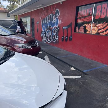 Konan BBQ - a white car parked in front of a red building - Barbeque Near Me - Tampa, Florida Konan BBQ - a white car parked in front of a red building - Barbeque Near Me - Tampa, Florida
