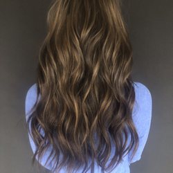 Iron Angel Hair Studio - We took this girl's blunt bob to long wavy locks with hand tied hair extension.  We also did a highlight and a rich chocolate base color.
