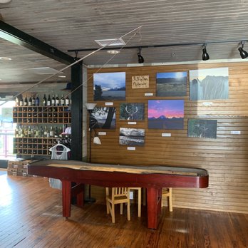 Goat Island Bottle Shop - a pool table in the foreground - Beer Bar Near Me - Rocky Mount, North Carolina
