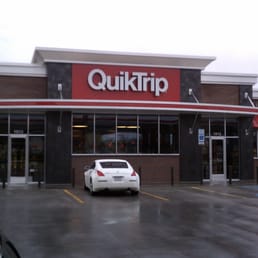 a car parked in front of a quiktripripripp store a car parked in front of a quiktripripripp store