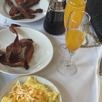 Lucille's - Applewood Bacon, cheese eggs & mango Mamosa - New American Near Me - Houston, Texas Lucille's - Applewood Bacon, cheese eggs & mango Mamosa - New American Near Me - Houston, Texas