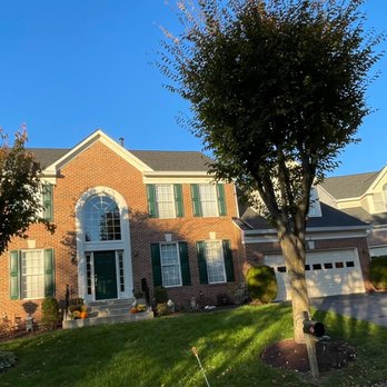 Ferman Painting - Final result of painting 16 shutters and trims around the front door and glass window on top of it. - Painters Near Me