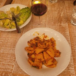 Photo of Rosalie Italian Soul - Houston, TX, United States. 1 weak Salad, 1 glass of red wine, and 1 kid sized chef boarder! ($55)