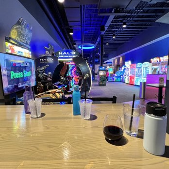 Doyle's Outpost - a table with drinks and snacks - Arcades Near Me - Alexandria, Virginia