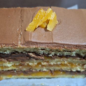 Copenhagen Pastry - Ready to be eaten is the slice of apricot chocolate mousse cake.  It was quickly devoured and it was delicious. - Bakeries Near Me - Culver City, California