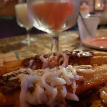 Pistolero's - Pork/chicken tamales with strawberry margarita - Mexican Near Me - Houston, Texas