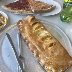 Pepperoni Pizza & Grill - Pepperoni Stromboli and Plain Cheese Pizza Slice