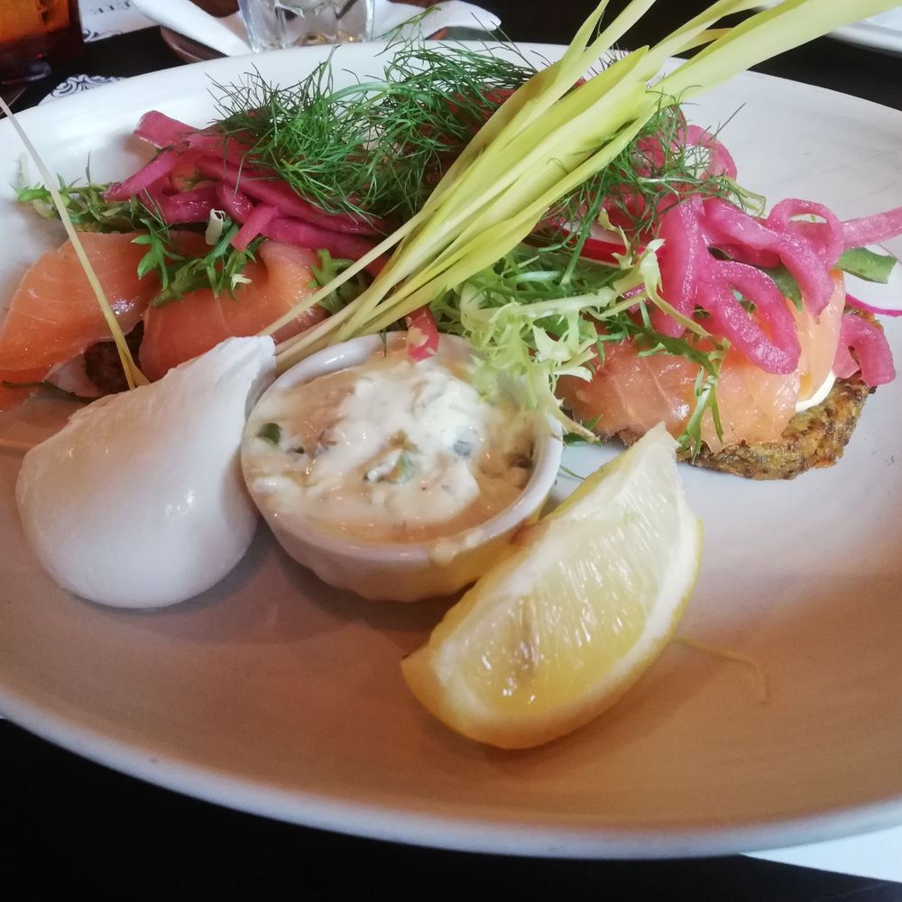 Janine Café - Latkes! Latkes with mayo pickle sauce, generous amount of smoked salmon, pickles red onions, greens and a poached egg. - Breakfast & Brunch Near Me - Montreal, Quebec Janine Café - Latkes! Latkes with mayo pickle sauce, generous amount of smoked salmon, pickles red onions, greens and a poached egg. - Breakfast & Brunch Near Me - Montreal, Quebec