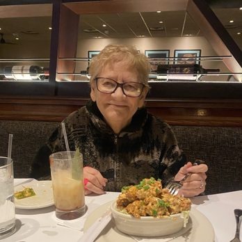Bonefish Grill - Happy mom with her bang bang shrimp - Seafood Near Me - Grand Rapids, Michigan