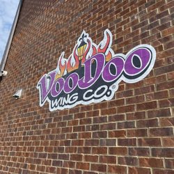 Voodoo Wing Company - Florence - Sign in back parking lot.