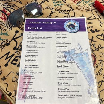 Dockside Daiquiris - a table with a menu and sunglasses - Cocktail Bars Near Me - Rockport, Texas Dockside Daiquiris - a table with a menu and sunglasses - Cocktail Bars Near Me - Rockport, Texas