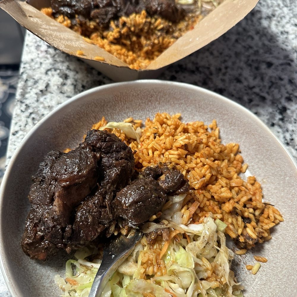 Wah Gwan - Oxtail with Jollof and Cabbage - Caribbean Near Me - Kansas City, Missouri