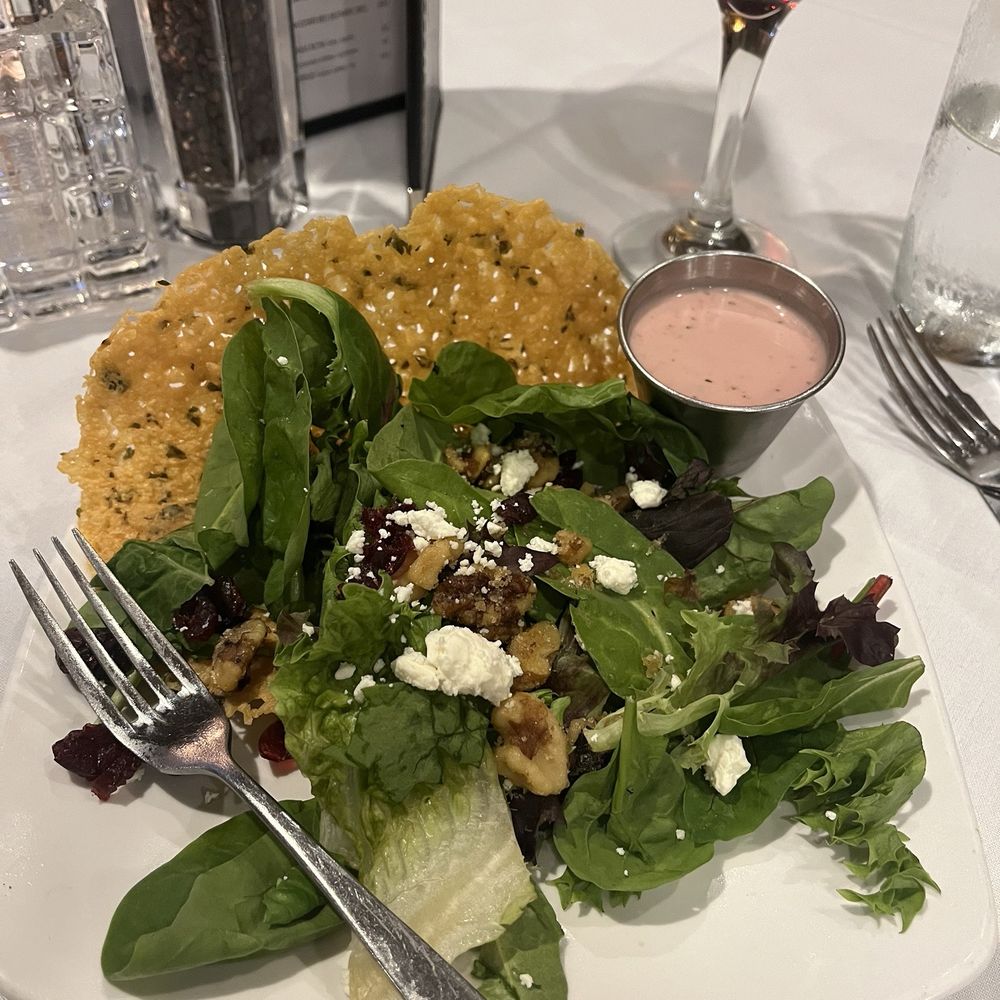 Before dinner house side salad with raspberry vinaigrette dressing. Before dinner house side salad with raspberry vinaigrette dressing.