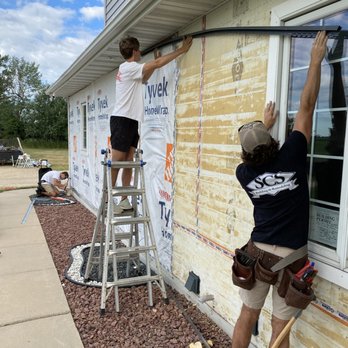 SCS Building & Remodeling - Guys working on siding - General Contractors Near Me - Madison, Wisconsin SCS Building & Remodeling - Guys working on siding - General Contractors Near Me - Madison, Wisconsin