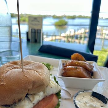 Deep Lagoon Seafood and Oyster House - BLACK GROUPER SANDWICH, grilled with plantains and a view. It's on the light lunch menu. - Seafood Near Me - Osprey, Florida Deep Lagoon Seafood and Oyster House - BLACK GROUPER SANDWICH, grilled with plantains and a view. It's on the light lunch menu. - Seafood Near Me - Osprey, Florida