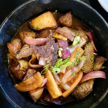 Limo Peruvian Eatery - Lomo Saltado/ Our House Speciality Choice of Protein / Onions / Sliced Tomato / Cilantro / Scallions / All sauteed in our flaming hot Wok - Peruvian Near Me - Nashville, Tennessee Limo Peruvian Eatery - Lomo Saltado/ Our House Speciality Choice of Protein / Onions / Sliced Tomato / Cilantro / Scallions / All sauteed in our flaming hot Wok - Peruvian Near Me - Nashville, Tennessee
