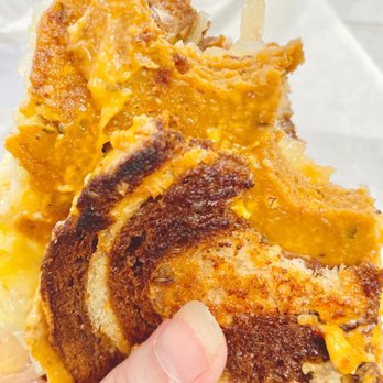 DC Vegetarian - a hand holding a grilled cheese sandwich - American Near Me - Portland, Oregon DC Vegetarian - a hand holding a grilled cheese sandwich - American Near Me - Portland, Oregon