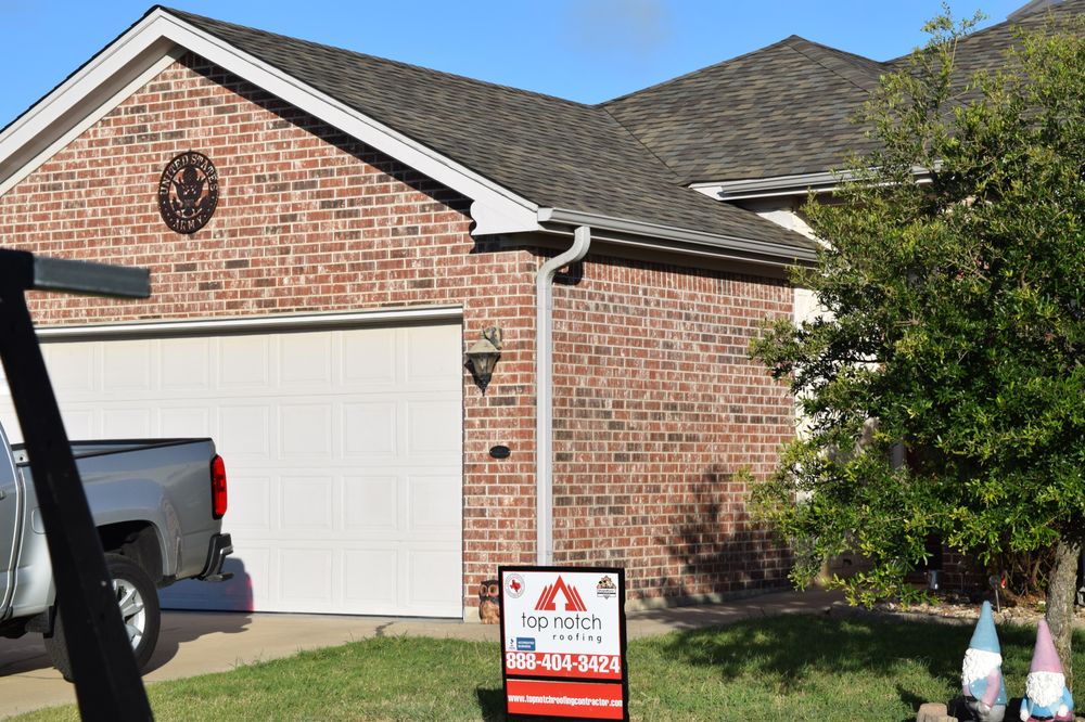 Slide of Top Notch Roofing