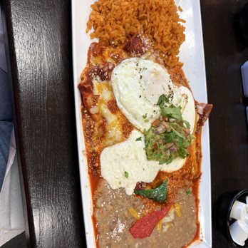 Las Palmas - Enchilada plate with rice and beans. Added an overeasy egg on top. Delicious - Mexican Near Me - San Dimas, California