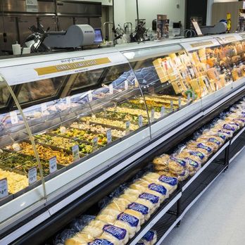 Meijer - a deli case filled with different types of food - Grocery Near Me - Mentor, Ohio