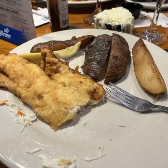 Sunset Grille - Fish & chips after first bite of fish - yes that is the size of the order of wedges. - Seafood Near Me - Saint Augustine, Florida