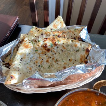 Indian Bites - Garlic naan with so much garlic. So good. - Indian Near Me - Longmont, Colorado Indian Bites - Garlic naan with so much garlic. So good. - Indian Near Me - Longmont, Colorado