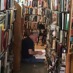 Village Book Exchange & Gifts - My husband in his happy place!