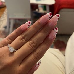 French tip nails with red hearts