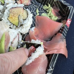 Sushi has plastic still on it Sushi has plastic still on it